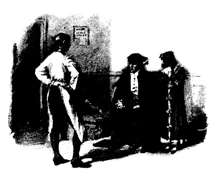 A boy standing in front of a seated man and a standing girl