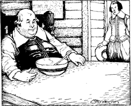 A man seated at a table with a bowl in front of him with another man approaching
