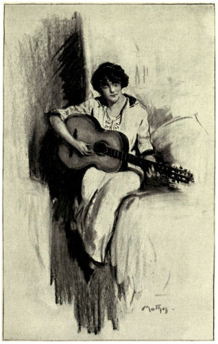 Helena sits playing a guitar