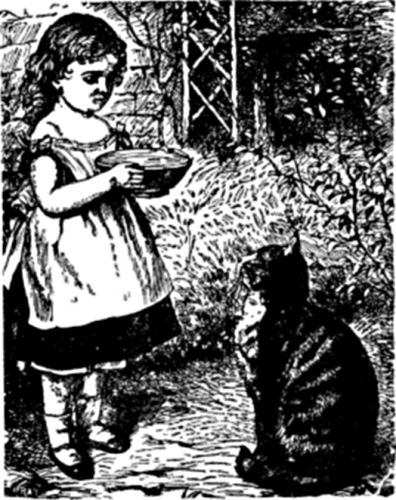 A cat sits looking up at a little girl, who is holding a bowl.