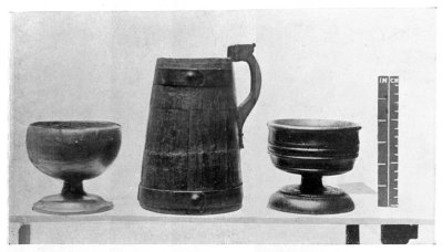 FIG. 21.—TWO WOODEN CUPS.

FIG. 22.—WOODEN FLAGON, WITH COPPER BANDS.

(In the National Museum of Wales.)