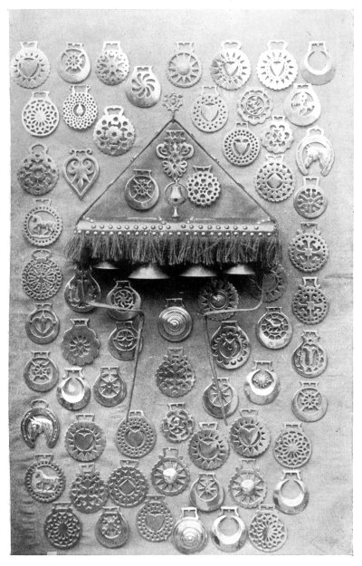 FIG. 84.—COLLECTION OF HARNESS AMULETS AND TEAM BELLS.

(In the possession of Mr. Charles Wayte, of Edenbridge.)
