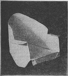 Fig. 94—Make the arm-chair of an
oblong envelope.
