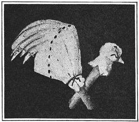 Fig. 104—Pull a little of the cotton out to make a beak.