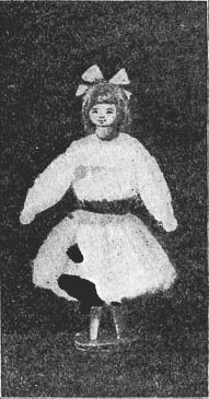 Fig. 114—Little girl doll made of a clothespin and dressed in raw cotton.