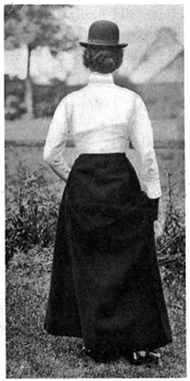 Rear view of standing woman without jacket