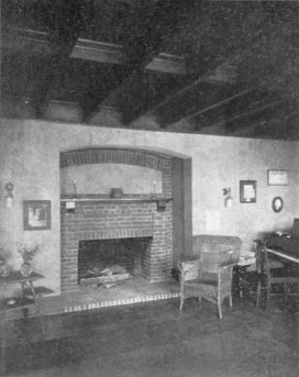 A Recessed Fireplace in Brick and Rough Plaster