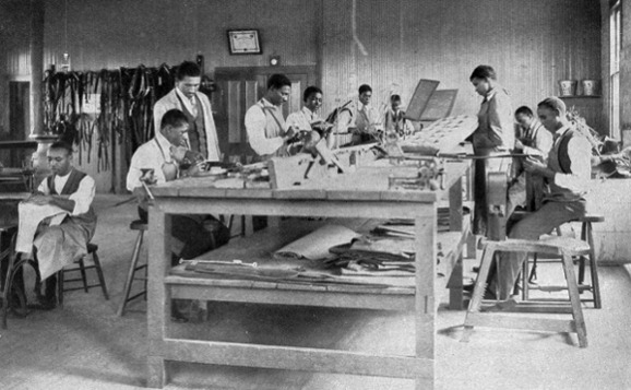 STUDENTS AT WORK IN THE HARNESS-SHOP.