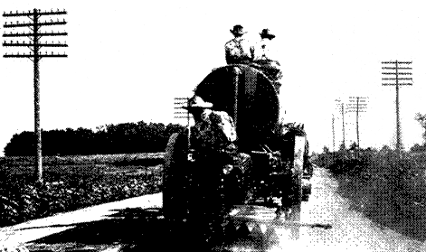 Fig. 20.—Oiling a Gravel Road