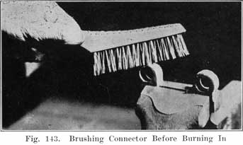 Fig. 143 Brushing connector before burning in
