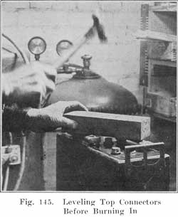 Fig. 145 Leveling top connectors before burning in