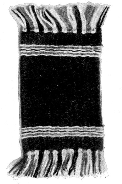 A deep blue wool rug made of carpet yarn