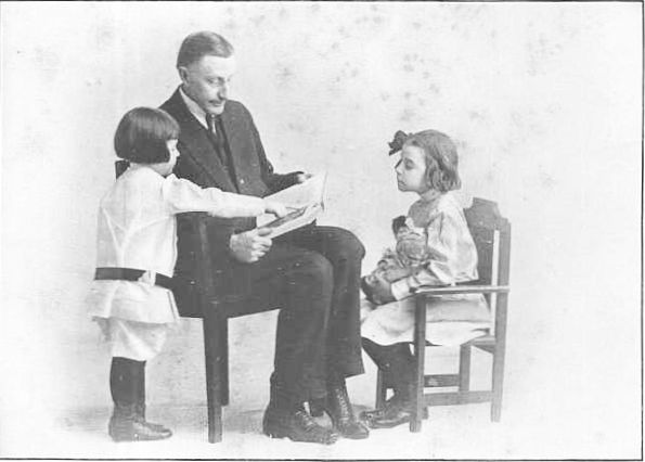 DR. STALL READING TO HIS GRANDCHILDREN