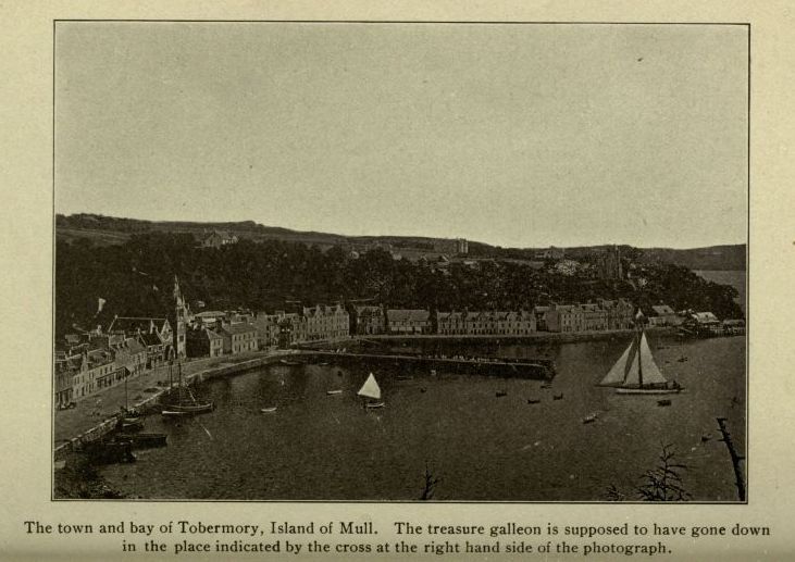 The town and bay of Tobermory, Island of Mull.  The treasure galleon is supposed to have gone down in the place indicated by the cross at the right hand side of the photograph.