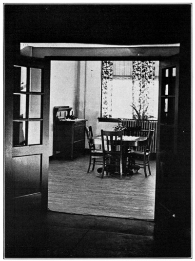 Figure 8.--Glass-paneled doors open from the dining room...