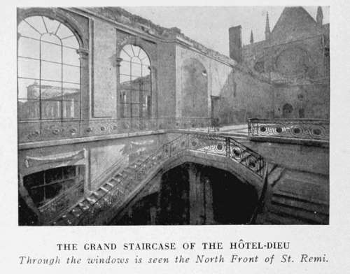 THE GRAND STAIRCASE OF THE HTEL-DIEU
Through the windows is seen the North Front of St. Remi.
