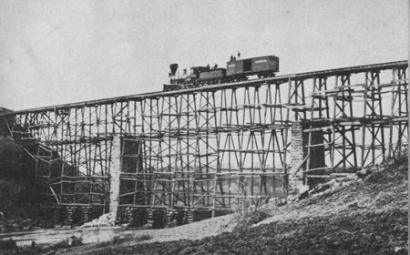 This "cornstalk" bridge over Potomac Creek near Fredericksburg was built by
the Military Railroad construction corps from 204,000 feet of standing timber in
nine days.