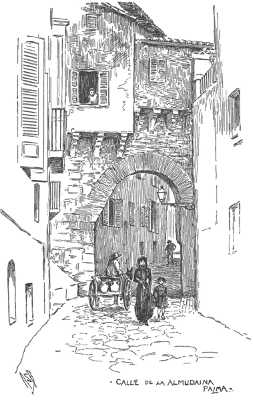 Narrow street with house arching over