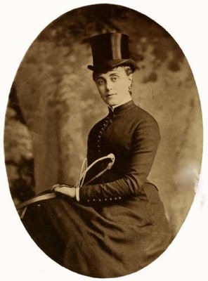 Photo of a woman in riding attire.