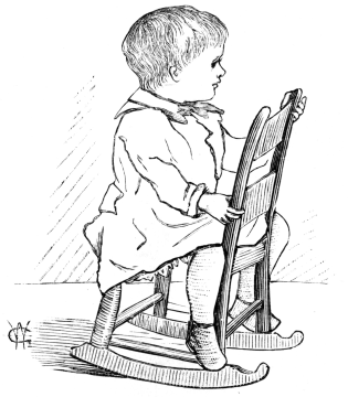 Toddler sitting backward on a child's rocking chair