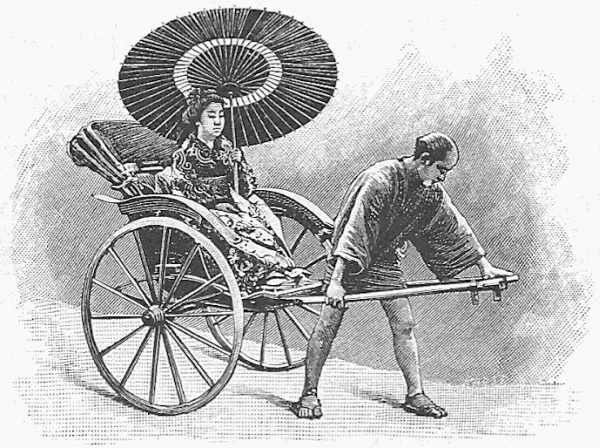 Man pulling a rickshaw with a lady in it