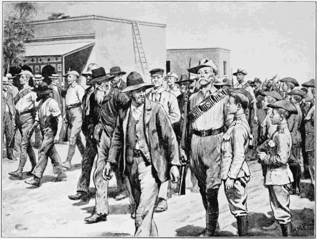 THE LAST ATTACK ON MAFEKING: B.S.A. POLICE ESCORTING BOER PRISONERS
TO THE GAOL