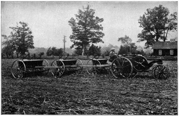 Small tractor with three grain drills