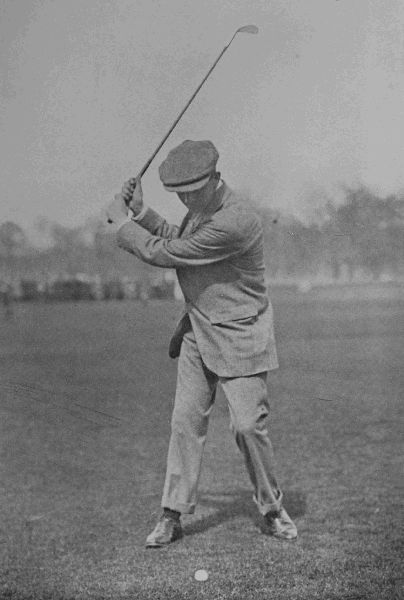 PLATE XIV.

J. SHERLOCK

Top of swing in iron-shot. Note the position of the ball, and the
upright swing of the club.