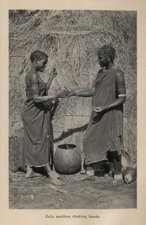 Zulu maidens shaking hands.