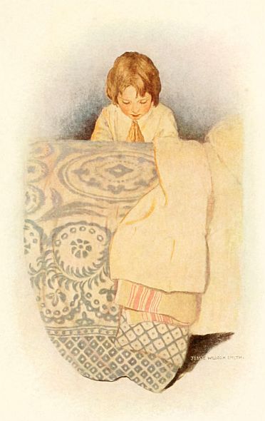 child praying beside bed