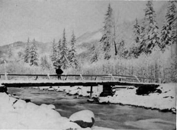 man on snowy bridge