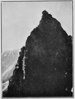 A party ascending the Aiguilles Rouges (Arolla). The
people can be seen on the sky-line to the left, at the top of the white
streak. By Mr. Leonard Rawlence.