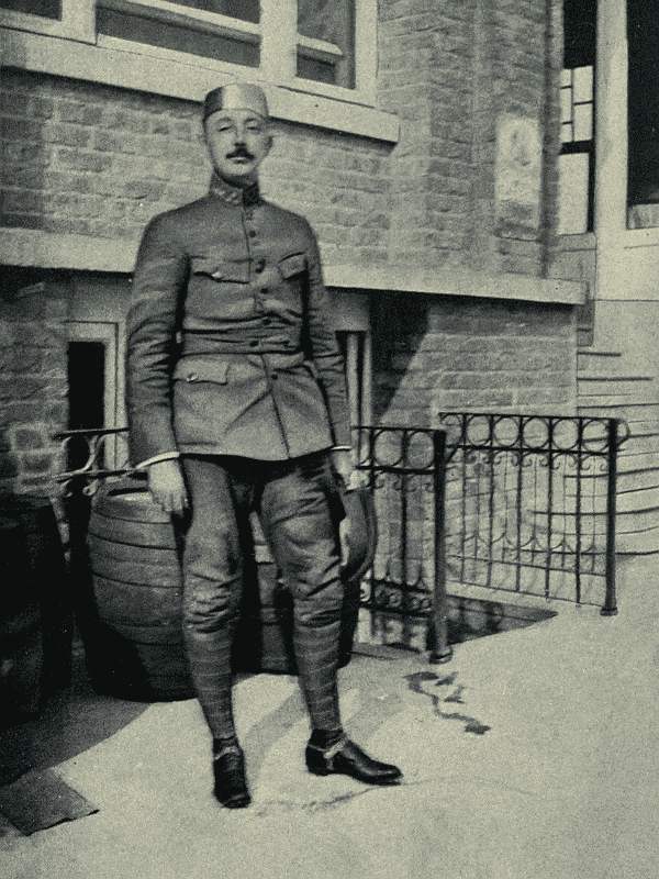The Commandant in the nickel-steel skull-cap worn inside his khaki cap