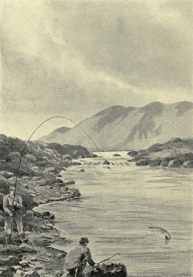 men fishing one with fish on the line and the other with a net