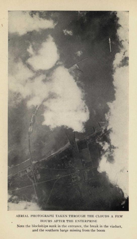 AERIAL PHOTOGRAPH TAKEN THROUGH THE CLOUDS A FEW HOURS AFTER THE ENTERPRISE. Note the blockships sunk in the entrance, the break in the viaduct, and the southern barge missing from the boom.