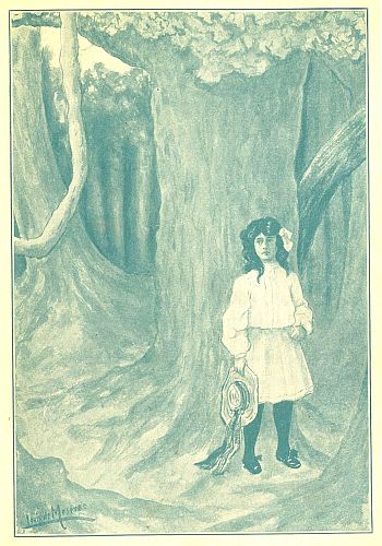 girl standing by large tree