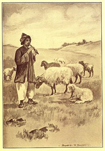 Shepherd playing pipe while watching sheep