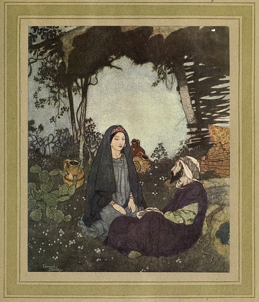 couple seated on gournd in forest