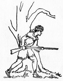 man, holding rifle, in woodsmans outfit looking around tree
