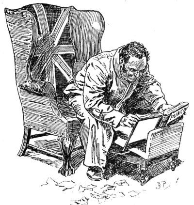 Man in dressing gown reading Punch