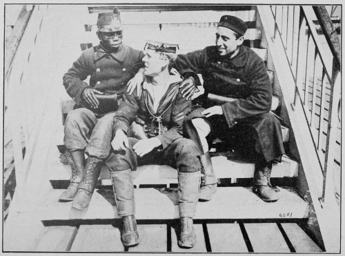 “ALLIES.” TWO BELGIAN SOLDIERS, ONE BEING FROM THE CONGO,
HAVING A CHAT WITH A JACK TAR ON THE QUAY AT OSTEND.

Photo by International News Service.
