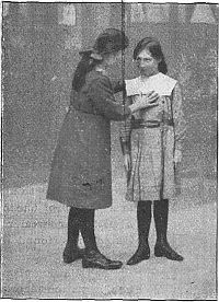 girl measuring another girl's arm