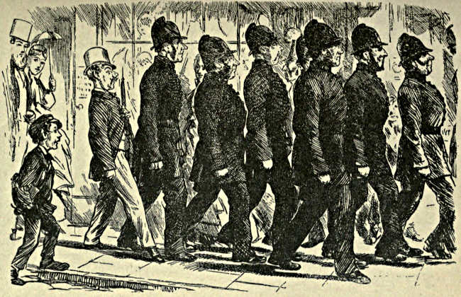 Procession of policemen, followed by Spadgett, marching in step