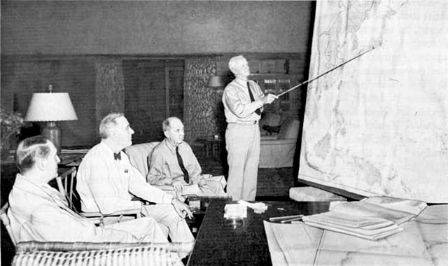 CONFERENCE AT PEARL HARBOR brings together (left to right) General Douglas MacArthur, President Franklin D. Roosevelt, Admiral William D. Leahy and Admiral Chester W. Nimitz.