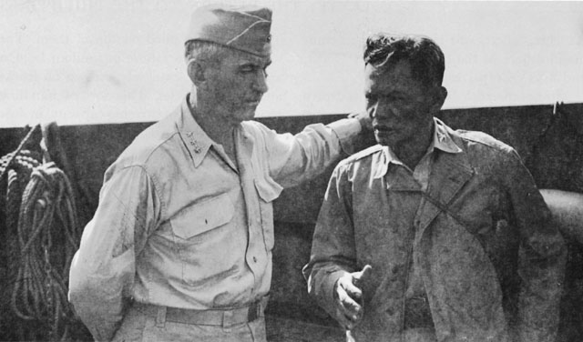 LT. GEN. WALTER KRUEGER AND COL. RUPERTO K. KANGLEON of the guerrilla forces head for the beach (above). Krueger talks with men of the 7th Division on the beach near Dulag (below).