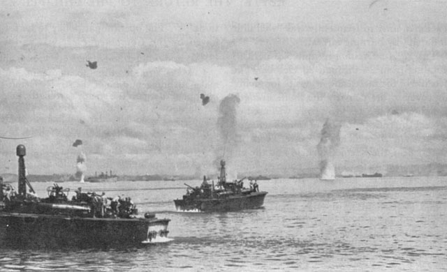 JAPANESE AIR ATTACKS on shipping (above) and supply dumps (below) were a constant threat during the early days of the invasion.