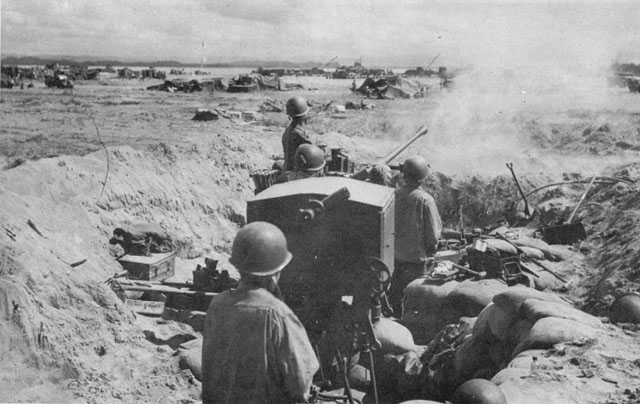 ANTIAIRCRAFT GUN in action at Tacloban airstrip, 27 October 1944.