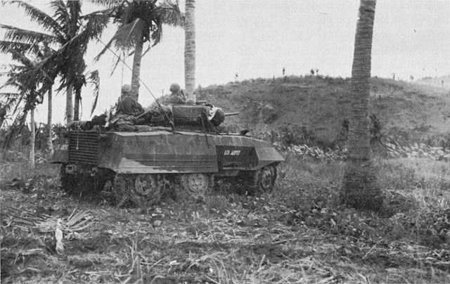 CREW OF A LIGHT ARMORED CAR M8 prepares to fire on enemy positions in the Labiranan Head sector.