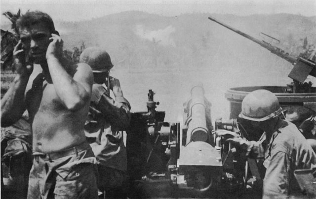 105-MM. SELF-PROPELLED HOWITZER M7 FIRING on Japanese positions on Catmon Hill.