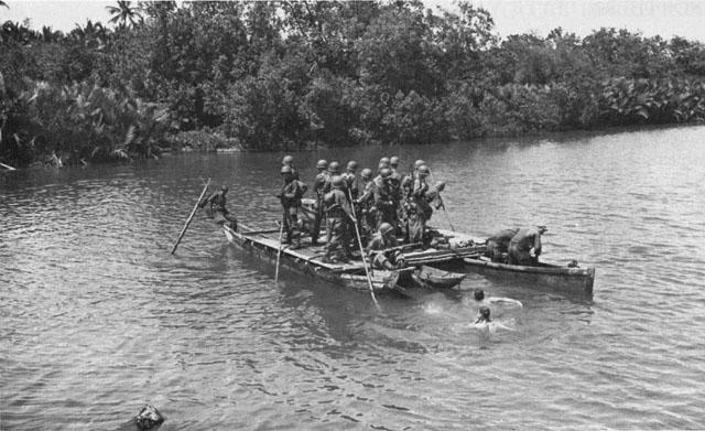 U.S. PATROL CROSSING THE CANOMONTAG RIVER (above). Engineer troops replacing a Capoocan River bridge blown up by retreating Japanese.